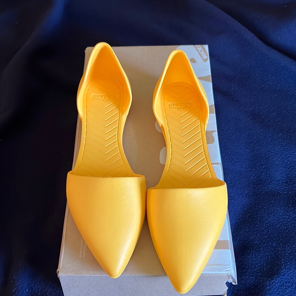 Yellow native shoes New, will ship in shoe box.